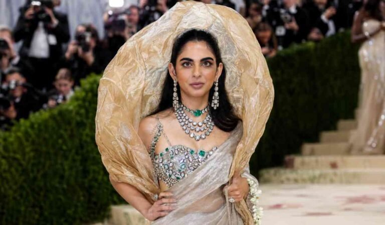 Isha Ambani MET Gala 2026 showing royal couture look with diamond and emerald jewellery on red carpet