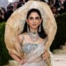 Isha Ambani MET Gala 2026 showing royal couture look with diamond and emerald jewellery on red carpet