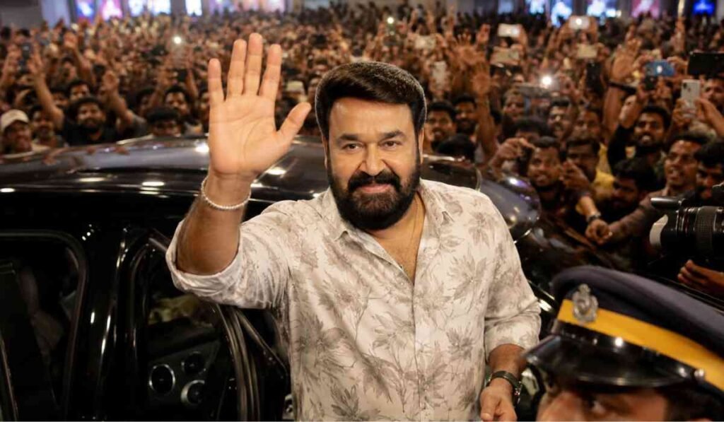 Drishyam 3 Movie Review Updates को दर्शाती हाई-क्वालिटी इमेज जिसमें Mohanlal फैंस के बीच फिल्म के First Day First Show सेलिब्रेशन में नजर आ रहे हैं।