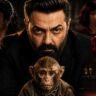 डार्क बैकग्राउंड में गंभीर लुक में नजर आ रहे Bobby Deol, सामने घायल बंदर और कोर्टरूम सीन के साथ सस्पेंस भरा फिल्म पोस्टर।